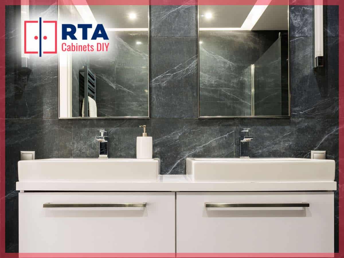 Modern bathroom with sleek white RTA cabinets and dual sinks against a dark marble wall